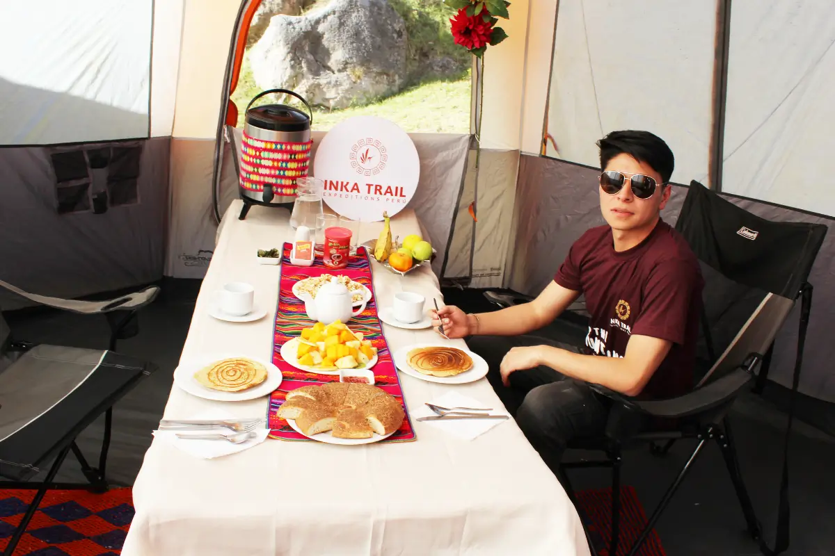 Afternoon tea time at the Inca Trail campsite with hot drinks and snacks during the trek to Machu Picchu